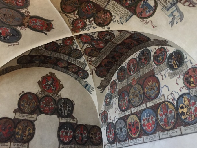 Royal Family crests painted on the walls inside Prague Castle