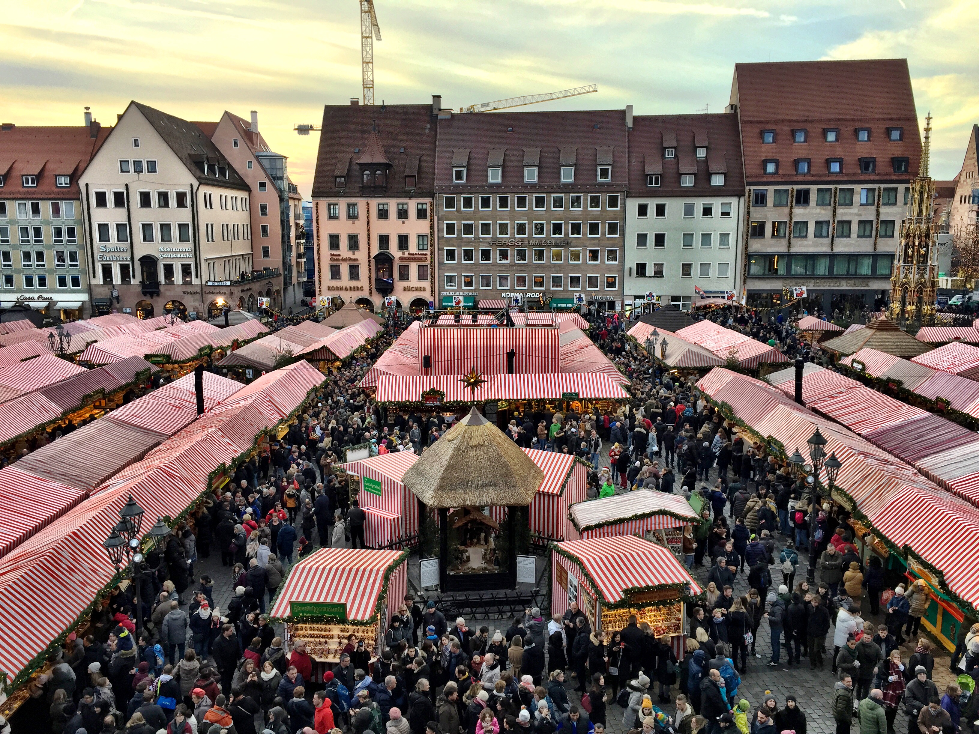 Is December a good time to visit Germany? The answer is yes. View from Cathedral balcony overlooking the Nuremberg Christmas market tents and crowds