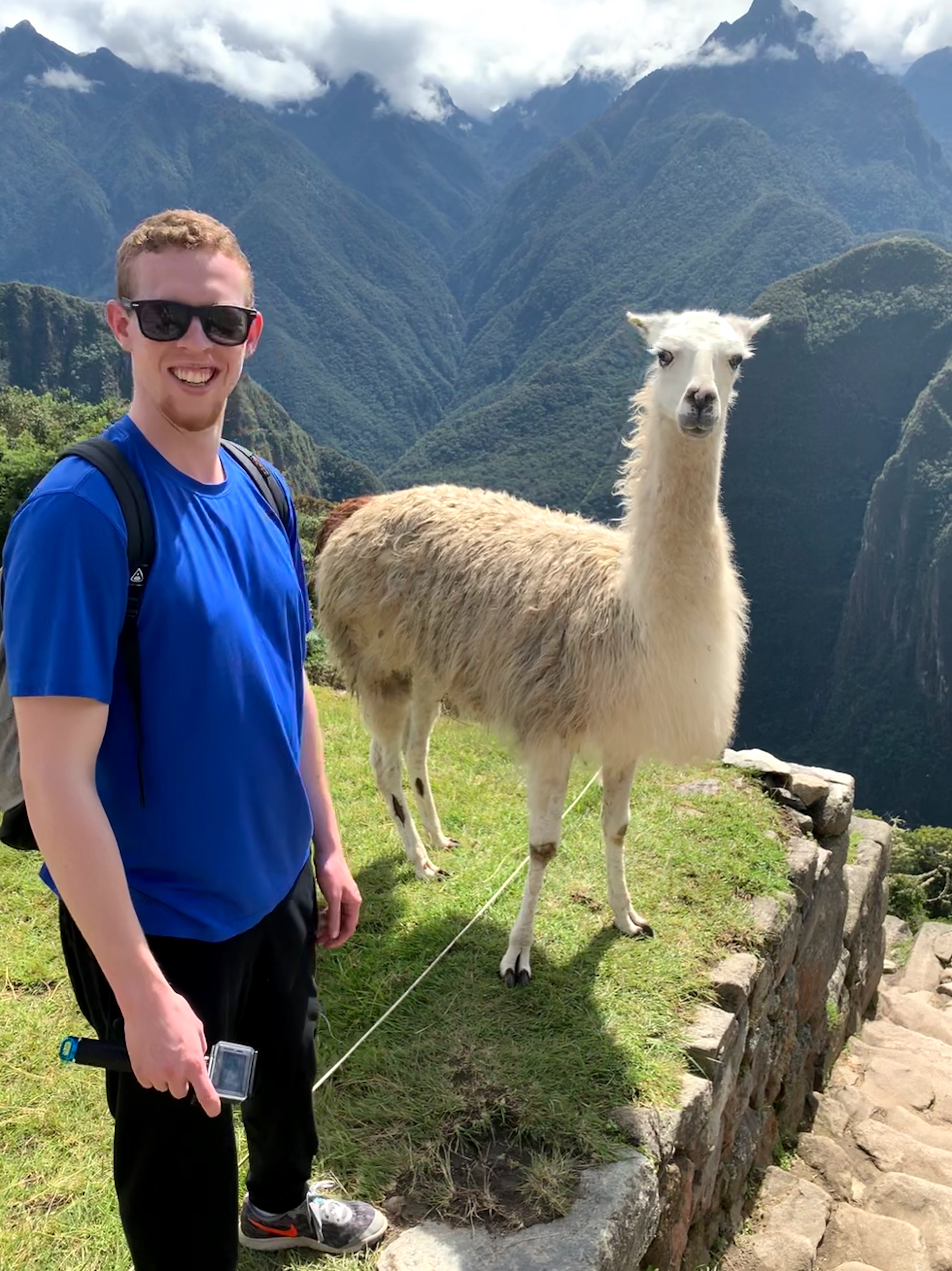 Mark with an alpaca at Machu Picchu