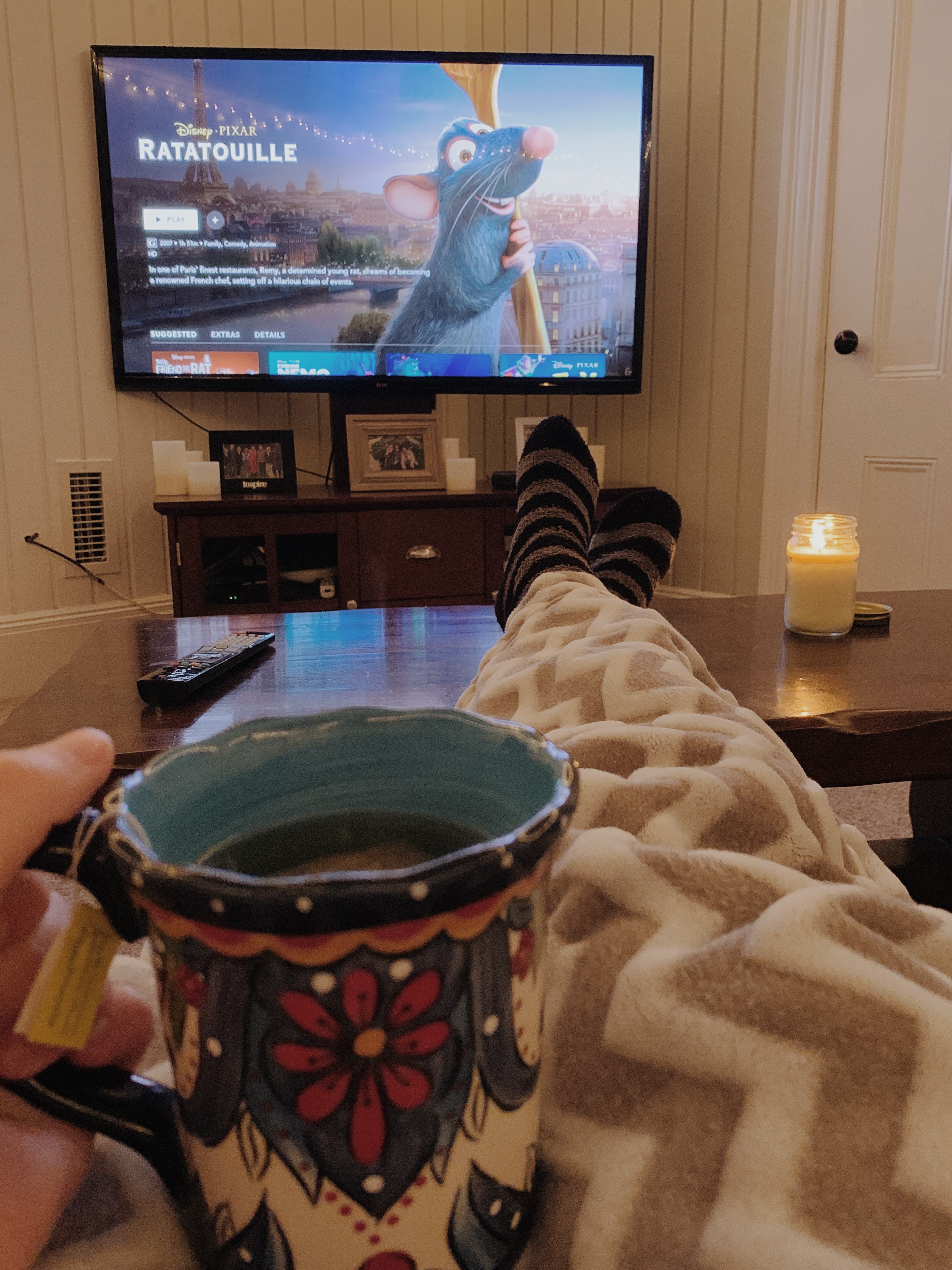 Cozy, watching travel movies with tea